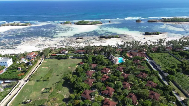 Crystal Bay, Watamu, from the air: the golf pitch, the gardens and the reef beyond