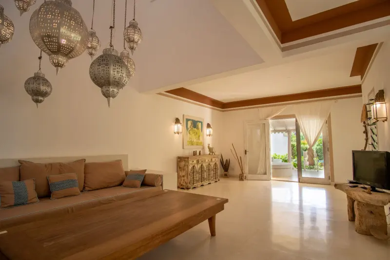 A living room by Orietta Mosca, with carved beams and lanterns
