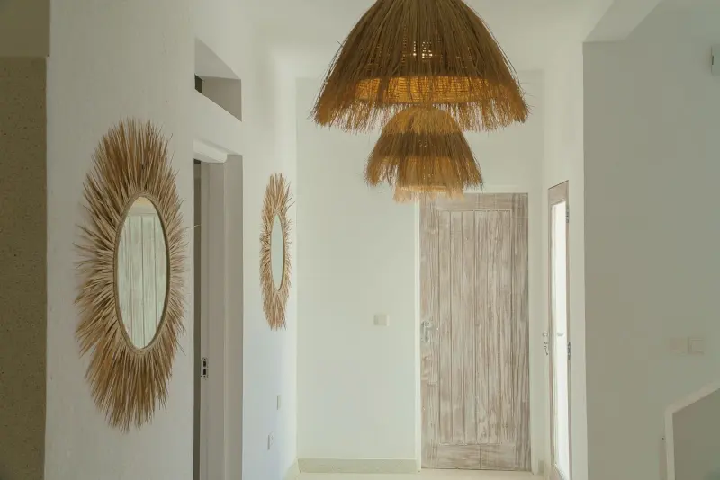 The hallway with a sunburst mirror