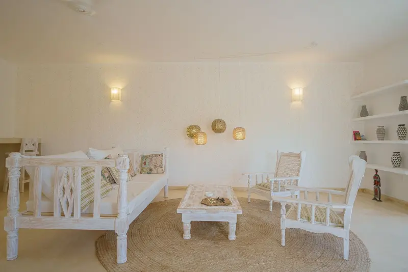 The living room with white wooden sofas