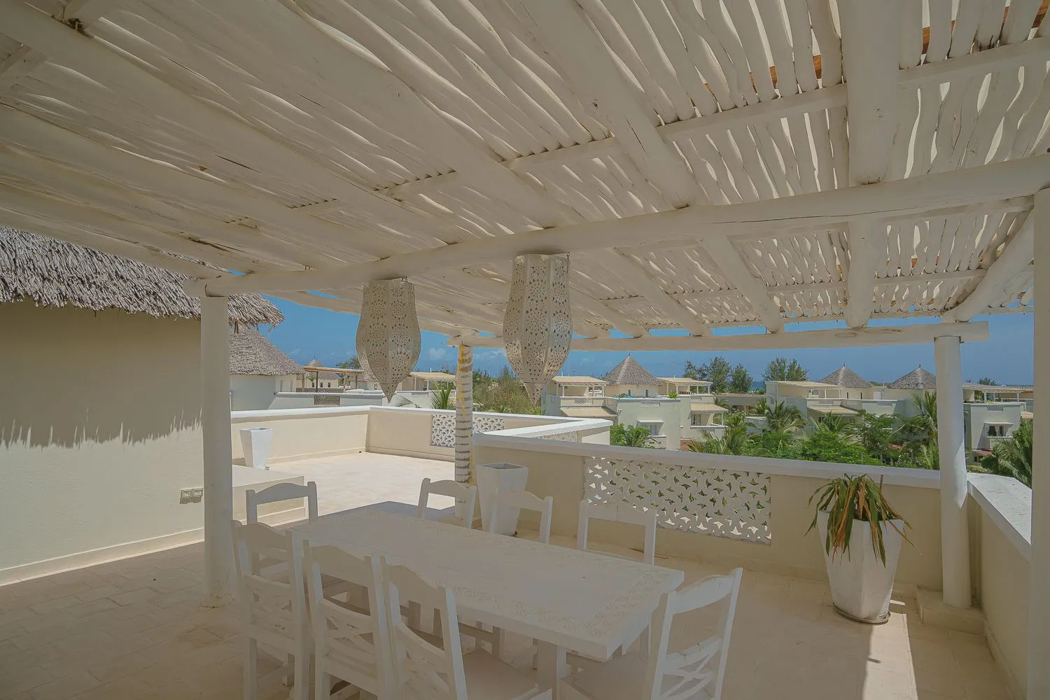 Dining under the pergola on Villa Shanti’s roof terrace